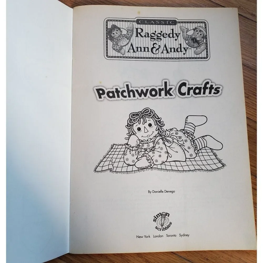 Raggedy Ann & Andy‎ patchwork crafts coloring book with fabric stickers 2006